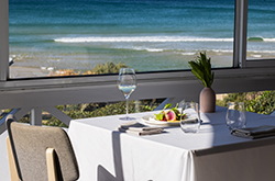 A set table with an ocean view at Pilu at Freshwater restaurant