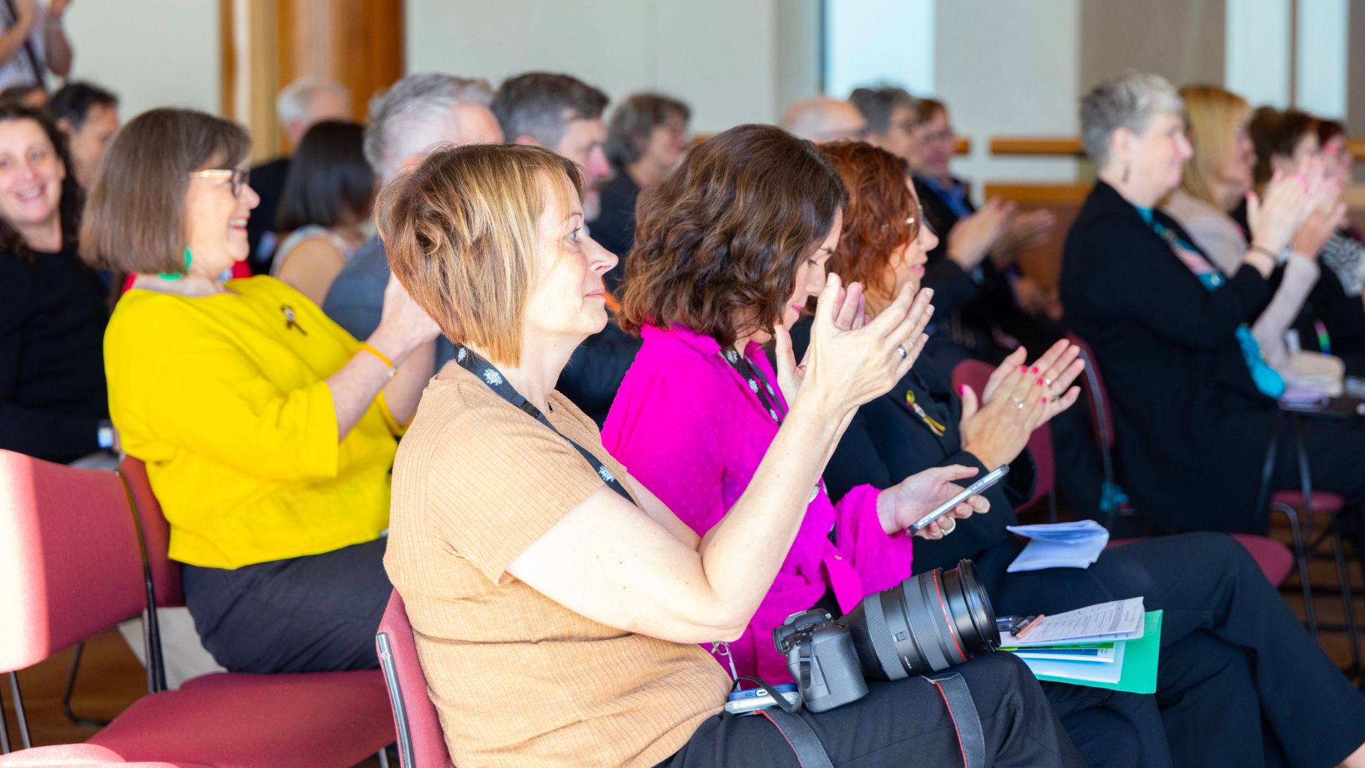 This is  a photo of the audience at a conference. 