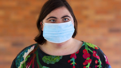 A woman wearing a face mask
