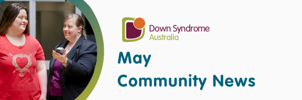 This is a photo of two females with Down syndrome smiling at each other. One has a phone. It also says Down Syndrome Australia May Community News