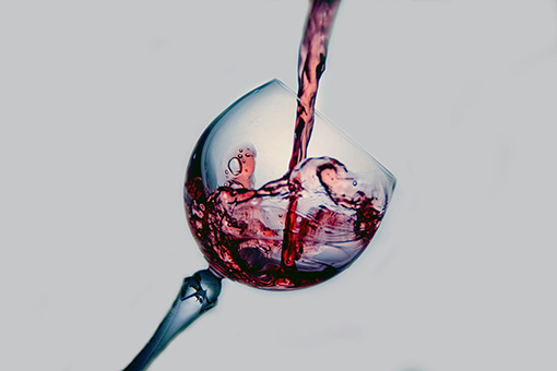 Red wine poured into a glass