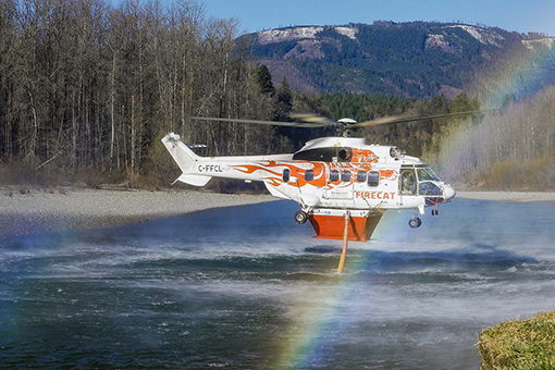 Helitak’s hover pump collecting water from river