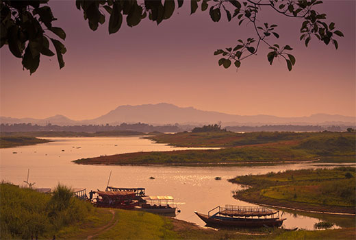 Sunset landscape with 2 boats on river in south-eastern Bangladesh