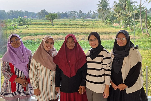 Dr Risti Permani, researchers and a female farmer on a farm in Java