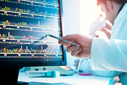 Scientist looking at a DNA sequence