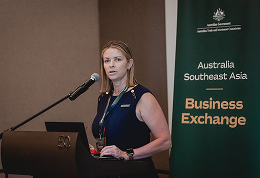 Trade Commissioner Melanie Harris presenting at lectern