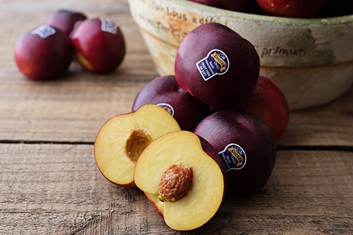 Yellow nectarines on a wooden table