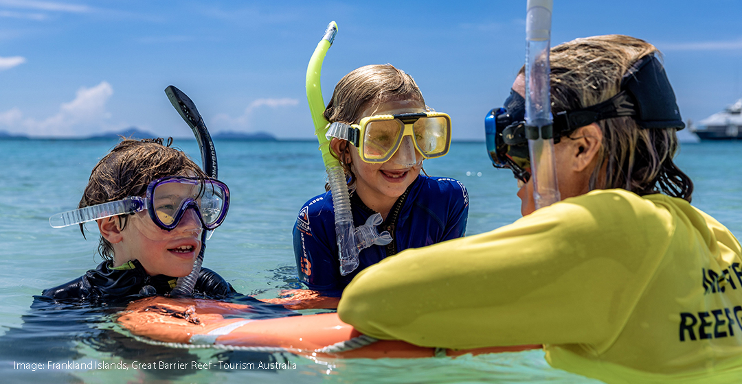 Instructor snorkelling with children