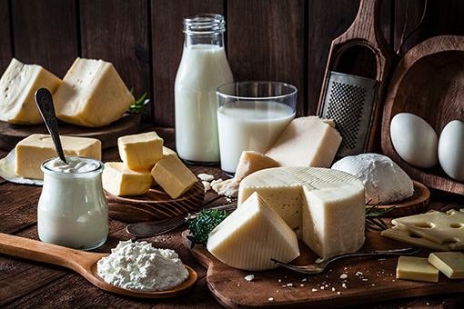 Assortment of dairy products on a wooden table