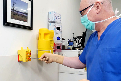 Medical professional using Qlicksmart's world-first single-handed scalpel blade remover